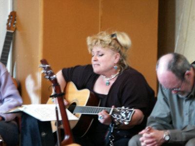 Jan Martin performs, whilst Michael Coyle looks pensive.
